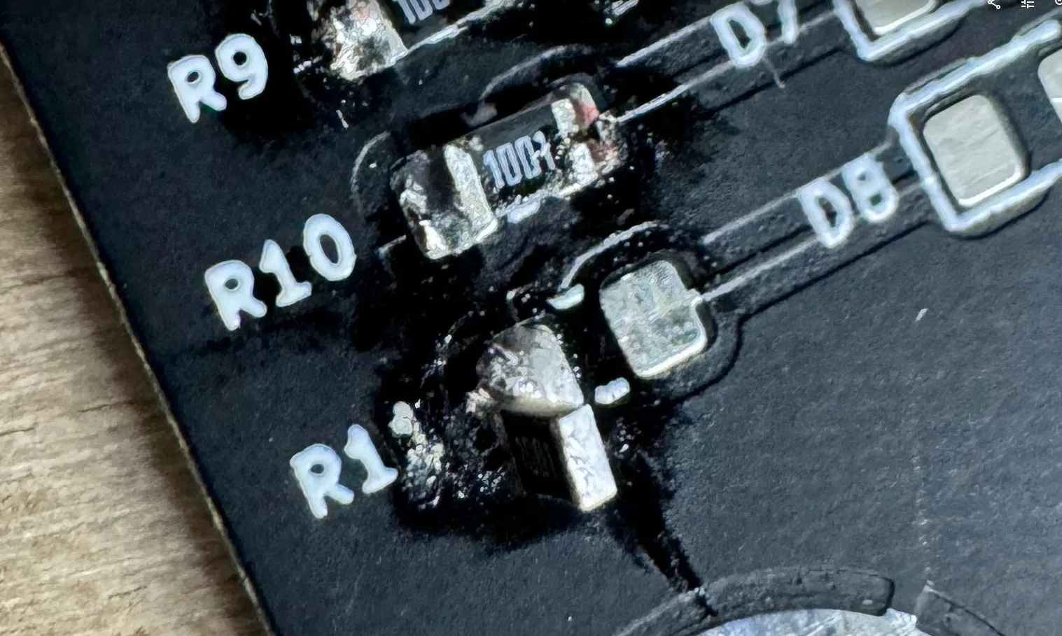 voltage regulator soldered at a weird angle and not making good contact